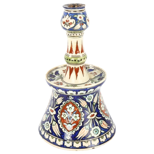 40 - A Portuguese pottery candlestick with painted decoration, height 28cm