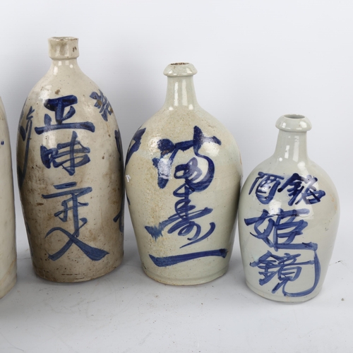 46 - 5 Japanese glazed ceramic bottles, with painted text, largest height 38cm