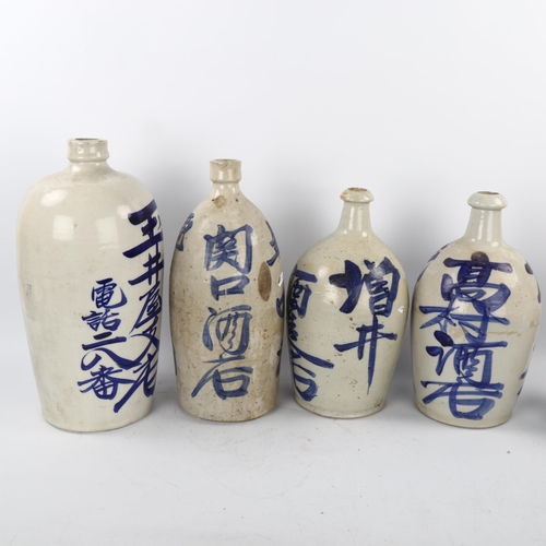 46 - 5 Japanese glazed ceramic bottles, with painted text, largest height 38cm