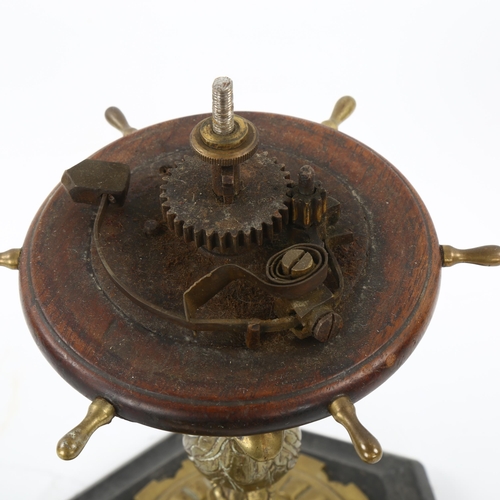 55 - A large Victorian brass and mahogany desk-top bell, operated by a brass and mahogany ship's wheel de... 