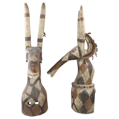 60 - A large pair of African Kurumba Tribal antelope design headdress masks, carved and painted wood with... 