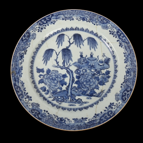 66 - An 18th century Chinese blue and white vessels charger, diameter 35cm, A/F