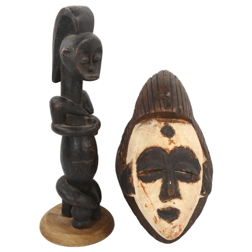 94 - A Gabon Punu carved wood mask, and a Gabon Fang reliquary figure, height 40cm (2)