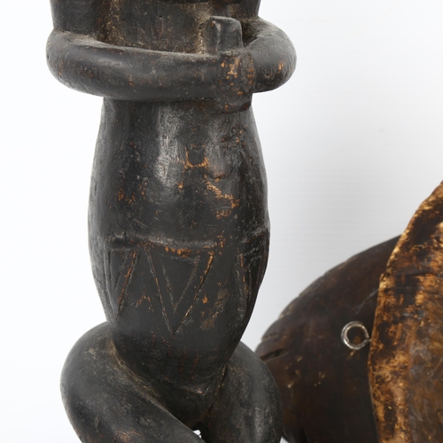 94 - A Gabon Punu carved wood mask, and a Gabon Fang reliquary figure, height 40cm (2)