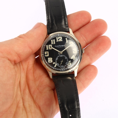 1009 - GIRARD-PERREGAUX - a stainless steel pilot's mechanical wristwatch, circa 1940s, black dial with lum... 