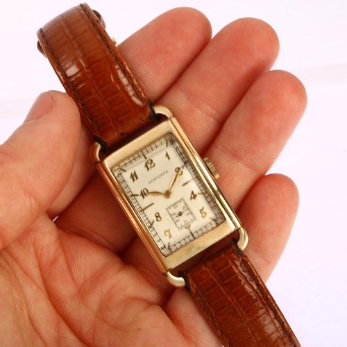 1013 - LONGINES - an American 10k gold filled mechanical wristwatch, circa 1930s, curved rectangular silver... 