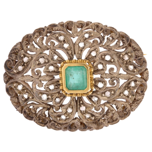 1109 - An emerald and diamond oval bombe brooch, unmarked gold and silver settings with central emerald ste... 