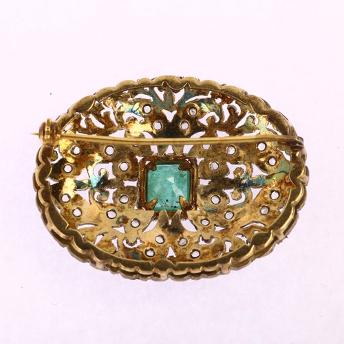 1109 - An emerald and diamond oval bombe brooch, unmarked gold and silver settings with central emerald ste... 