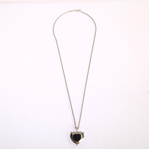 1111 - CHOPARD - an 18ct gold hematite and diamond heart pendant necklace, set with modern round brilliant-... 