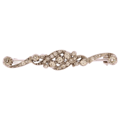 1112 - An Edwardian diamond bar brooch, unmarked white gold settings with old-cut diamonds, total diamond c... 