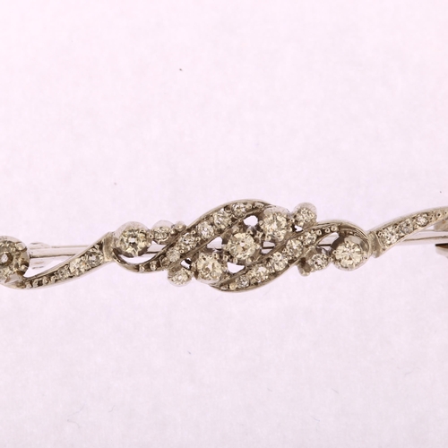 1112 - An Edwardian diamond bar brooch, unmarked white gold settings with old-cut diamonds, total diamond c... 