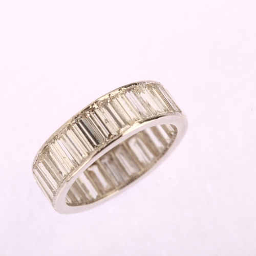 1119 - A diamond full eternity ring, set throughout with baguette-cut diamonds, with unmarked platinum sett... 