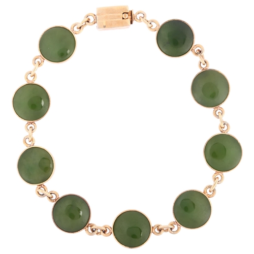 1120 - An early 20th century jade panel bracelet, unmarked rose gold closed-back settings, jade diameter 10... 