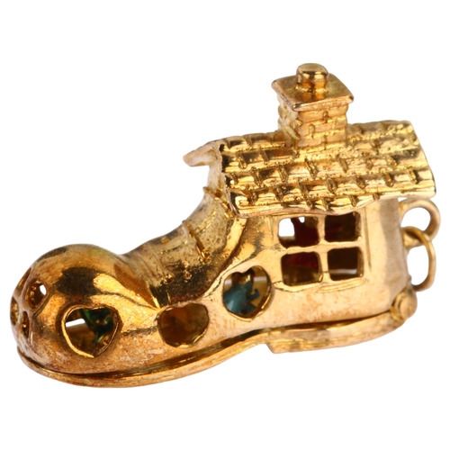 1127 - A mid-20th century 9ct gold shoe house fairytale kinetic charm/pendant, opening to reveal enamel fig... 