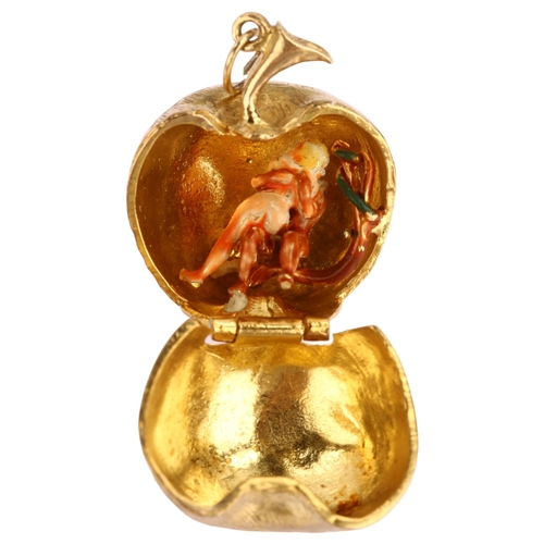 1128 - A mid-20th century 9ct gold Adam Eve and the Apple kinetic charm/pendant, opening to reveal enamel f... 