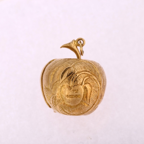 1128 - A mid-20th century 9ct gold Adam Eve and the Apple kinetic charm/pendant, opening to reveal enamel f... 