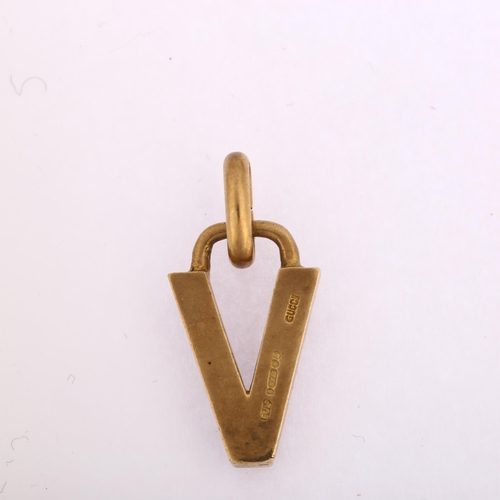 1133 - GUCCI - a late 20th century 9ct gold initial V charm/pendant, signed, maker's marks EJ Ltd, London 1... 