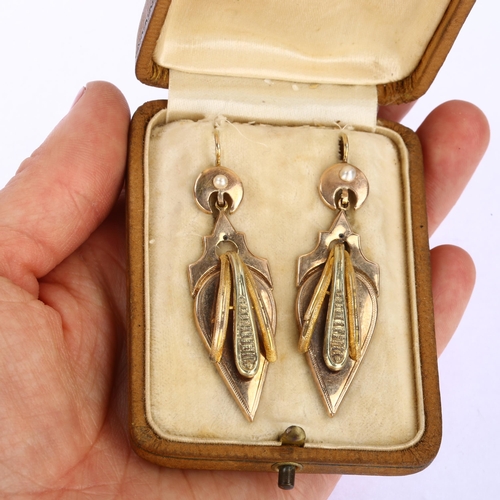 1138 - A pair of 19th century French two-colour gold drop earrings, with split pearl crescent moon shepherd... 