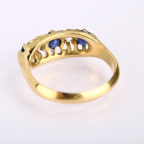 1139 - An early 20th century graduated five stone sapphire and diamond half hoop ring, unmarked 18ct gold s... 