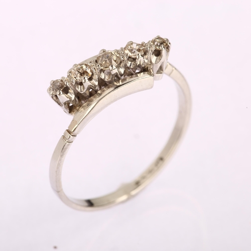 1142 - An Art Deco platinum five stone diamond crossover ring, set with old-cut diamonds, total diamond con... 