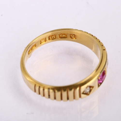 1143 - A Victorian 18ct gold three stone ruby and diamond ring, maker's marks WGM, Birmingham 1881, setting... 