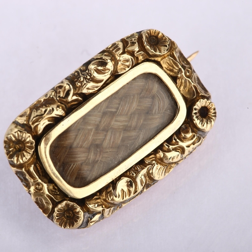 1147 - A Georgian woven hair memorial brooch, unmarked gold closed-back settings with floral border and cen... 