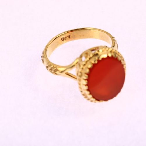 1155 - An Antique 9ct gold carnelian signet ring, with openwork scrolled bridge and raised leaf shank, 17.5... 