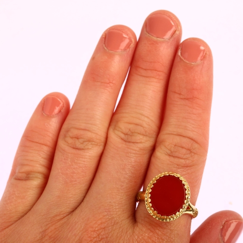 1155 - An Antique 9ct gold carnelian signet ring, with openwork scrolled bridge and raised leaf shank, 17.5... 