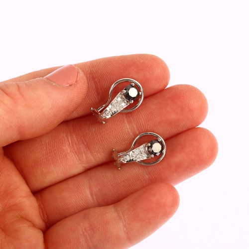 1159 - A pair of modern black diamond and diamond clip-on earrings, unmarked white metal settings with mode... 