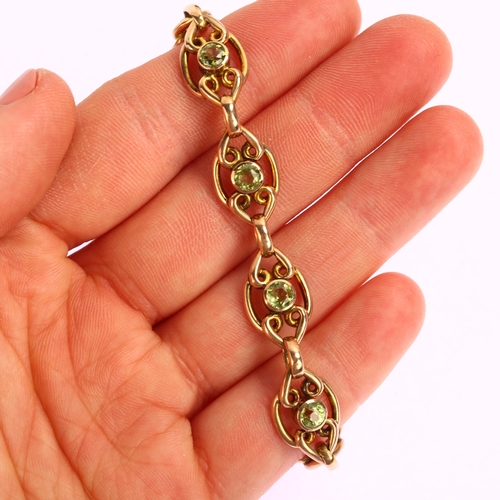 1164 - An Edwardian 9ct gold peridot panel bracelet, length 18cm, 13.5g