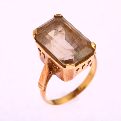 1173 - A late 20th century smoky quartz dress ring, unmarked gold settings with rectangular step-cut quartz... 