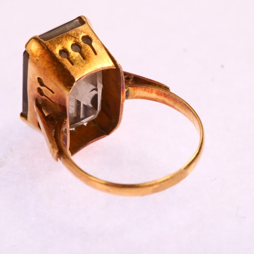 1173 - A late 20th century smoky quartz dress ring, unmarked gold settings with rectangular step-cut quartz... 