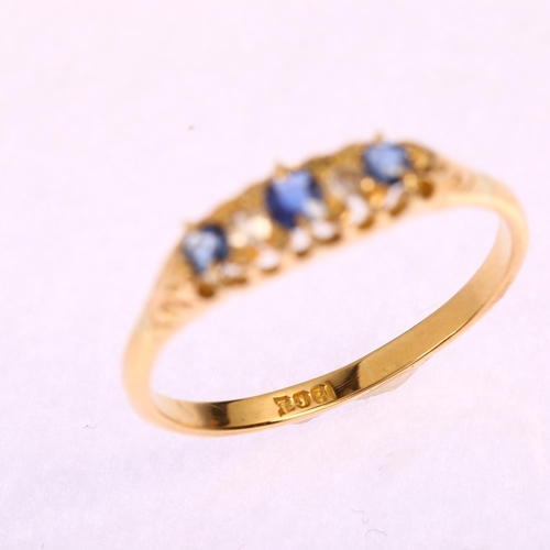 1184 - An early 20th century 18ct graduated five stone sapphire and diamond half hoop ring, setting height ... 