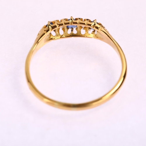 1184 - An early 20th century 18ct graduated five stone sapphire and diamond half hoop ring, setting height ... 