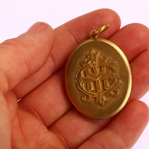 1186 - A Victorian gilt-metal photo locket pendant, with applied monogram AEI, pendant height 44mm, 14.8g