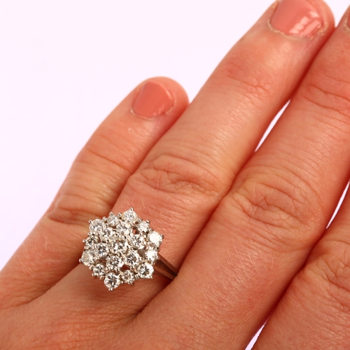 1191 - An 18ct white gold diamond flowerhead cluster ring, prong set with modern round brilliant-cut diamon... 