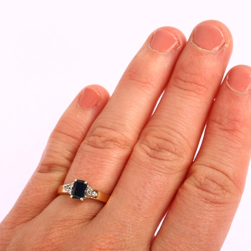 1196 - A modern 9ct gold solitaire sapphire ring, with diamond trio shoulders, set with rectangular step-cu... 