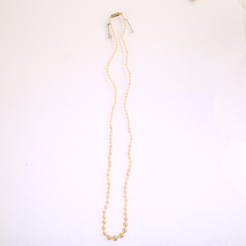 1212 - An Antique graduated single-strand pearl necklace, with unmarked gold rose-cut diamond clasp, pearls... 