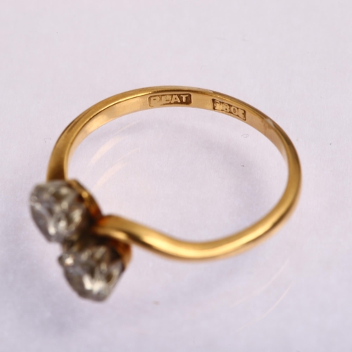 1220 - An early 20th century 18ct gold two stone diamond crossover ring, prong set with modern round brilli... 