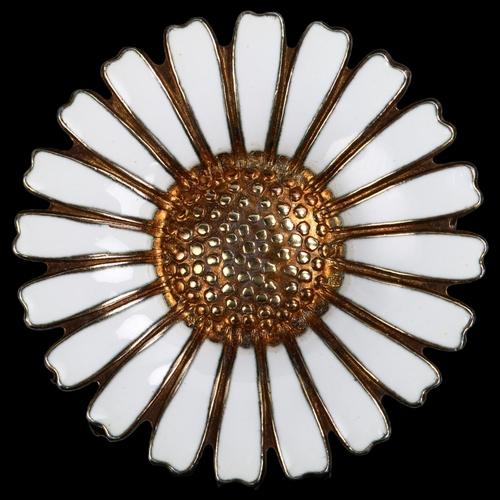 1261 - BERNHARD HERTZ - a Danish vermeil sterling silver and white enamel daisy pattern brooch, diameter 36... 