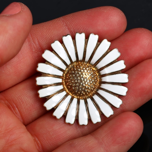 1261 - BERNHARD HERTZ - a Danish vermeil sterling silver and white enamel daisy pattern brooch, diameter 36... 