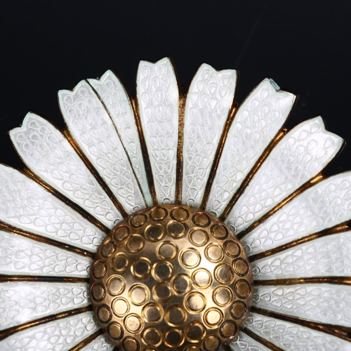 1262 - ANTON MICHELSEN - a large Danish vermeil sterling silver and white enamel daisy pattern brooch, diam... 