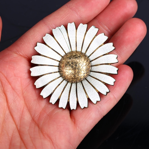 1262 - ANTON MICHELSEN - a large Danish vermeil sterling silver and white enamel daisy pattern brooch, diam... 