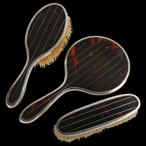 1456 - A George V Art Deco silver and tortoiseshell pique inlaid 3-piece dressing table set, comprising han... 