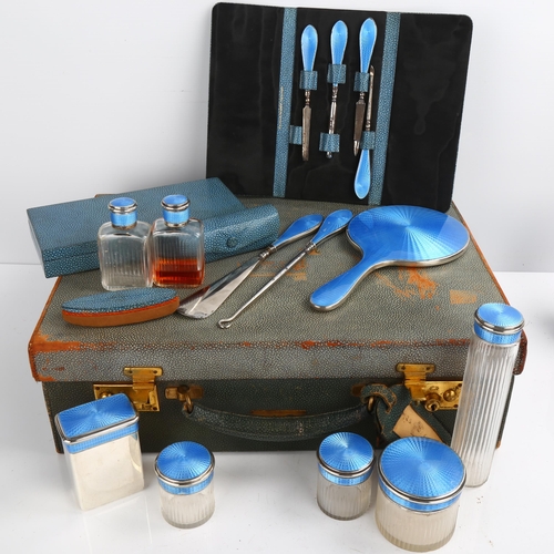 1460 - A George V Art Deco silver and blue enamel travelling vanity set, retailed by Finnigans, Henry Matth... 