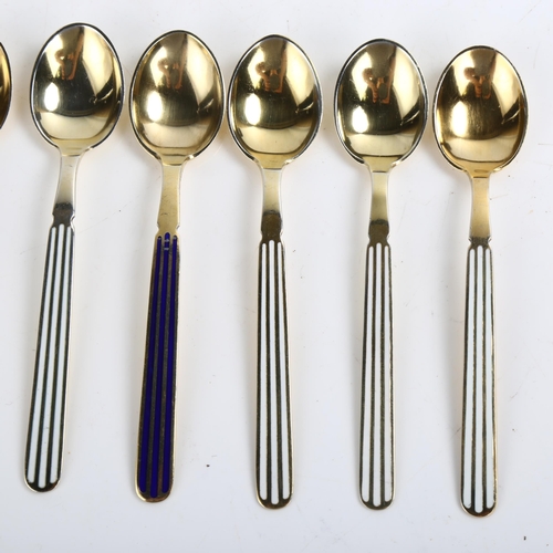 1464 - ANTON MICHELSEN - a set of 7 Danish vermeil sterling silver and harlequin enamel coffee spoons, leng... 