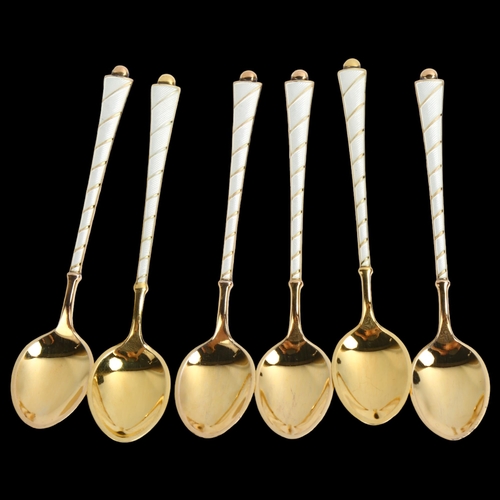 1465 - EGON LAURIDSEN - a set of 6 Danish vermeil sterling silver and white enamel coffee spoons, length 9.... 