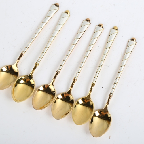 1465 - EGON LAURIDSEN - a set of 6 Danish vermeil sterling silver and white enamel coffee spoons, length 9.... 