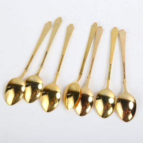 1466 - EGON LAURIDSEN - a set of 7 Danish vermeil sterling silver and white enamel coffee spoons, length 9.... 