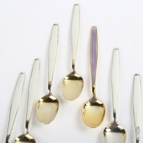 1467 - A set of 7 Norwegian vermeil sterling silver and harlequin enamel coffee spoons, maker's marks JT, l... 